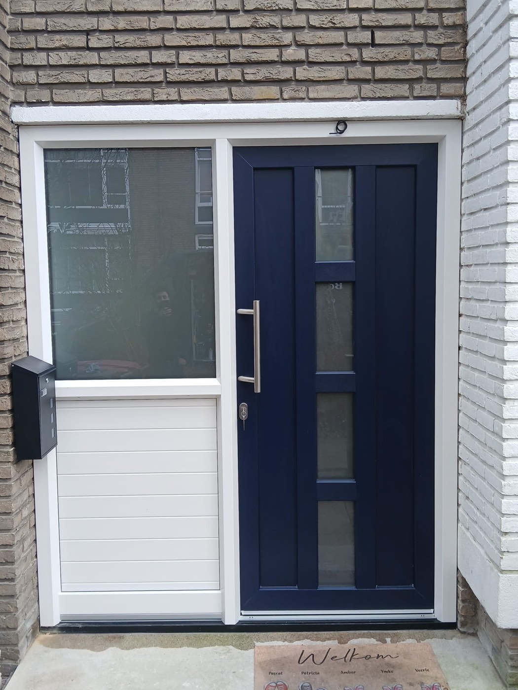 Voordeur blauw met zijpaneel